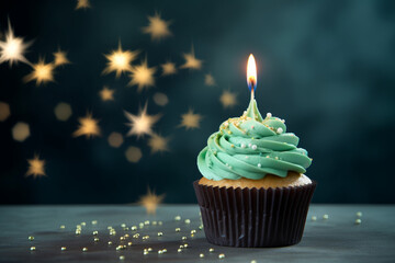 delicious mint birthday cupcake adorned with candle burning decorations takes center stage,...