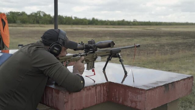 The shooter is preparing to shoot at competitions in a sitting position