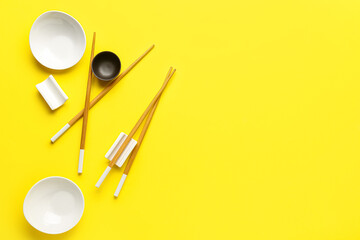 Chinese tableware on yellow background