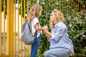 Parent giving support to the child before going to school.