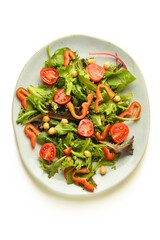 Plate with fresh vegetable salad on white background