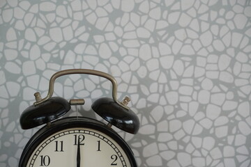 alarm clock against grey background