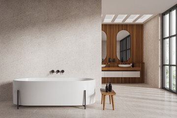 Modern hotel studio interior with tub, washbasin and window. Empty wall