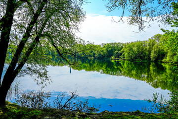 Ölpersee near Braunschweig in the Okeraue. Landscape by the lake with the surrounding nature.
