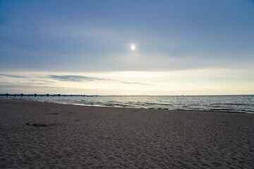 Sunset on the Baltic Sea in Poland. Landscape in the evening with setting sun by the sea.