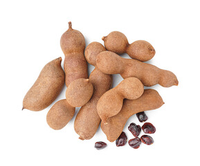 Heap of tasty tamarinds and seeds on white background