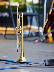 The wind instrument trumpet stands on stage before a jazz concert