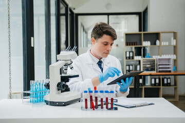 Male scientist researcher conducting an experiment in a laboratory.