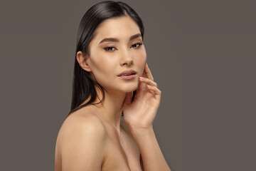 Well-groomed asian woman with healthy glowing skin.