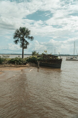 A shipwreck on a city beach in Saint-Laurent-du-Maroni a city the South American country of French...