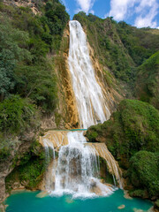 Waterfall with crystal clear blue water in the jungle, El-Chiflon, Mexico