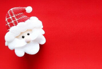 Red cute mini Santa Claus on red copy space background, concept of joyful Christmas party is coming...