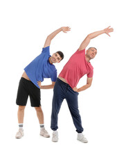 Mature man with rehabilitation therapist stretching on white background