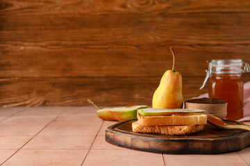 Wooden board with tasty pear jam and bread on orange tile table - Powered by Adobe