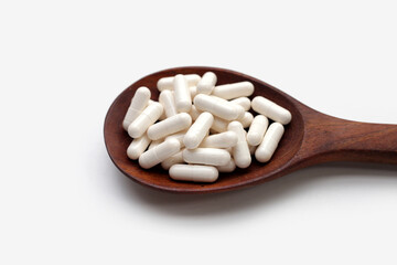 Medicine capsules on white background.