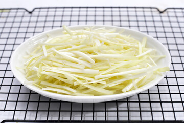 White garlic chives on white backgreound.