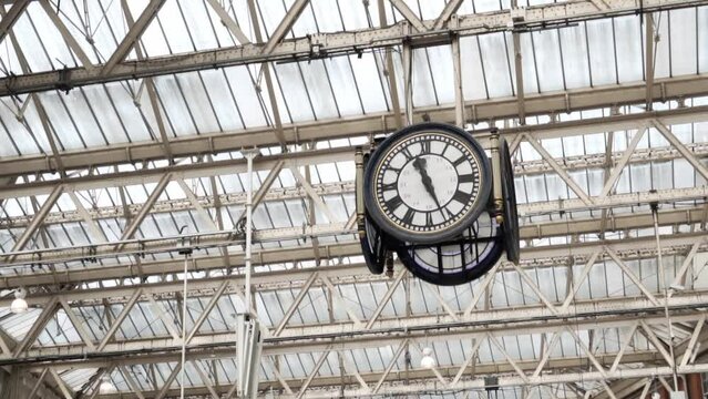 Close up footage of clock in waterloo station in London. Beautiful, old architecture in famous British Waterloo station. Famous tourist attraction in London, united kingdom.