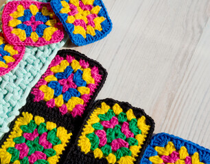 Knitted zigzag handmade ornaments and skeins of multi-colored threads.