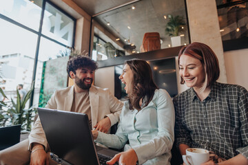 Guessed by luck. Brunette girl guessed the solution of the problem by luck, she is happy and laughing with her colleagues