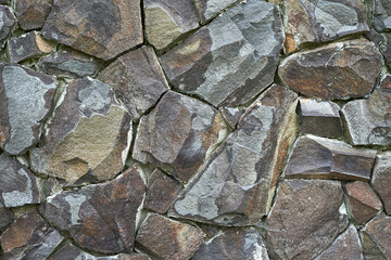 the wall is lined with natural stone texture