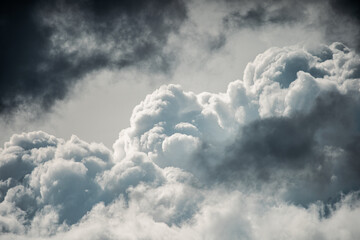 Awe-Inspiring Sky Contrast: Dramatic Dark Clouds Meet Radiant Sunlit Fluffiness, Perfect Wallpaper