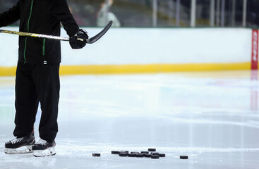 ice hockey player with pucks 