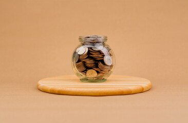 Saving money in a glass bottle Finance and investment, coins, generating income, cash flow, income,...