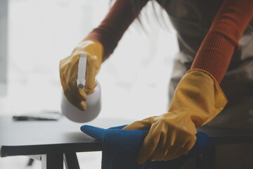 Office Cleaning Service. Janitor Spraying Desk. Workplace Hygiene
