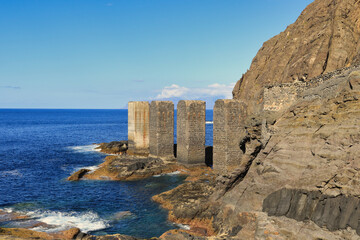 The Hermigua Davit (La Gomera. Canary Islands). These large stone towers that emerge from the sea served to provide entry and exit for goods and people.