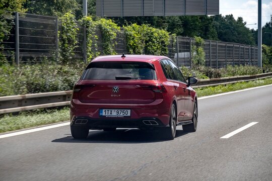 Volkswagen Golf Mark VIII red car driving on a highway