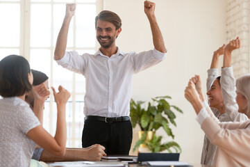 Successful businessman team leader company owner department boss raise hands celebrate corporate...