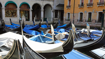 gondolas moored in the waterway in Venice, Italy during the lockdown without tourists
