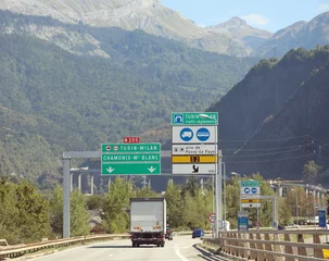 Tuinposter Mont Blanc road signs with the indication to reach the Mont Blanc tunnel which connects France with Italy