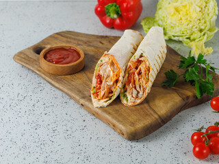Shawarma Sandwich, Doner Kebab, Chicken Shawarma on grey wooden background with sause