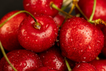 delicious collected and wet cherry berries with pits