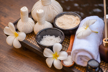 Soft and select focus Spa massage compress balls, herbal ball and treatments spa on the wooden.