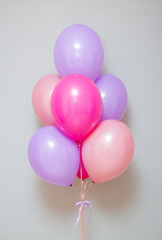 bunch of pink and purple helium balloons, birthday