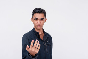 An angsty male teen daring someone to approach. Making a challenge. Isolated on a white background.