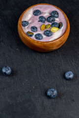 fresh purple and white yogurt with blueberries and blueberry berry flavor