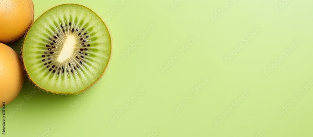 Poster kiwi fruit on a isolated pastel background copy space closeup top view