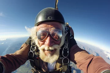 Schilderijen op glas old man flies on parachute, extreme sport concept, active lifestyle © Michael