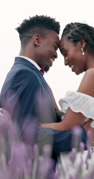 Outdoor, hug and black couple with marriage, wedding and happiness with romance, event and celebration. African man, woman and embrace outside, love or happy bride with groom, romantic and commitment