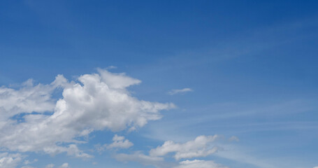Panorama blue sky clouds pattern on daylight with copy space. Cumulus cloudscape air climate sunny day. Blue sky fluffy white clouds on summer season bright clear skyline with beautiful cloudscape