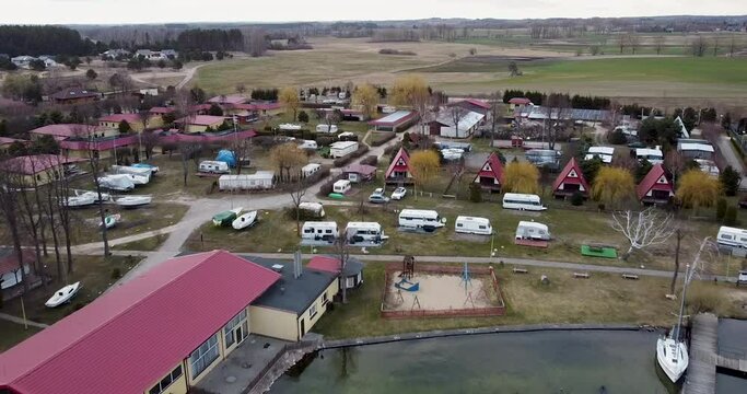Drone aerial view of Village on Czaplinek city in Poland near a lake where is also a camping spot