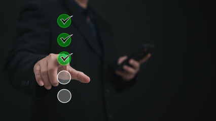 Performance checklist concept : businessman using stylus pen with laptop for questionnaire, evaluation, assessment online or survey exam and filling out for digital survey and checklist.	
