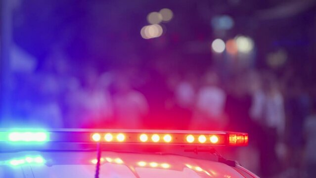Police siren against the background of people walking down the street