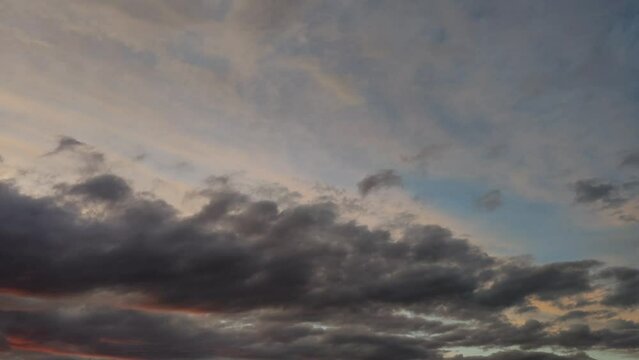 Landscape with orange sky that changes to a more intense color at sunset