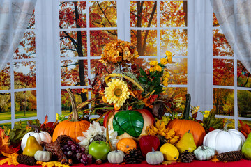 fall cornucopia of fruits flowers pumpkins and vintage cookie jar on red with large autumn window...