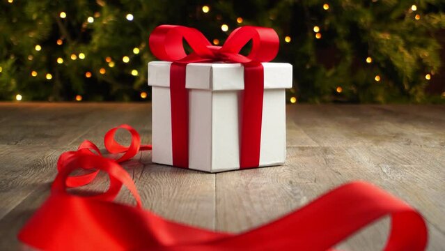 Christmas gift on old wooden floor, Christmas tree background