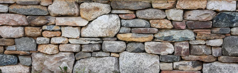 Fotobehang stone wall, rustic and timeless, offers textural depth, symbolizing strength, stability, and the enduring beauty of natural materials © Your Hand Please